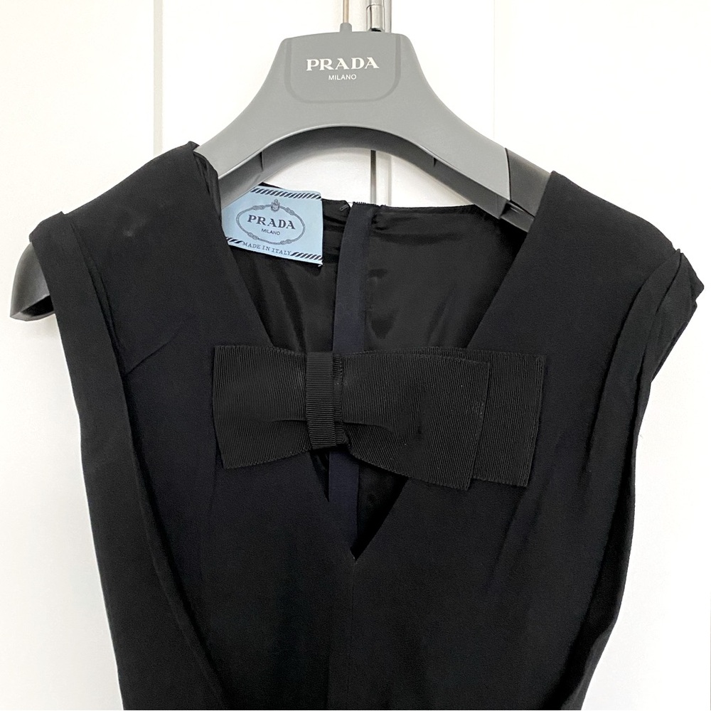 PRADA black dress. Sleeveless, v-neck with ribbon across and vela belt